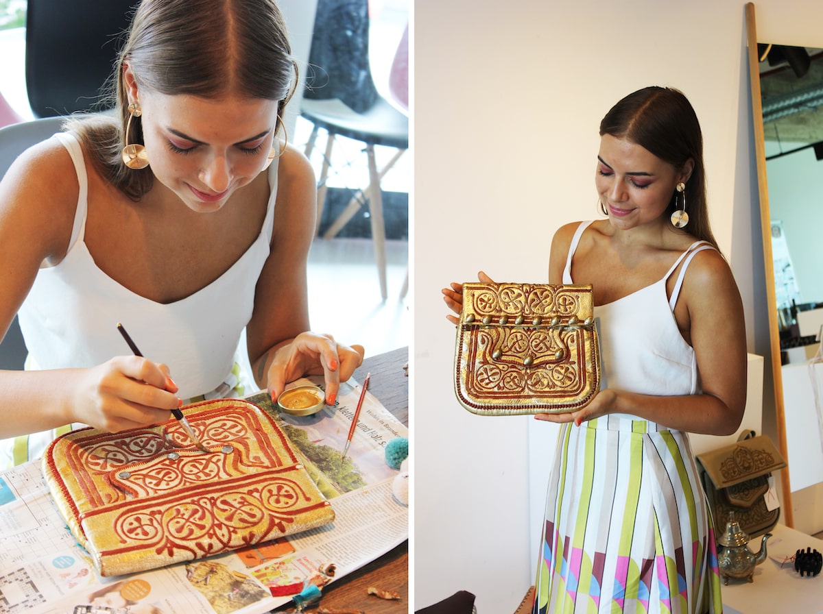 picture of someone painting on a vintage berber bag