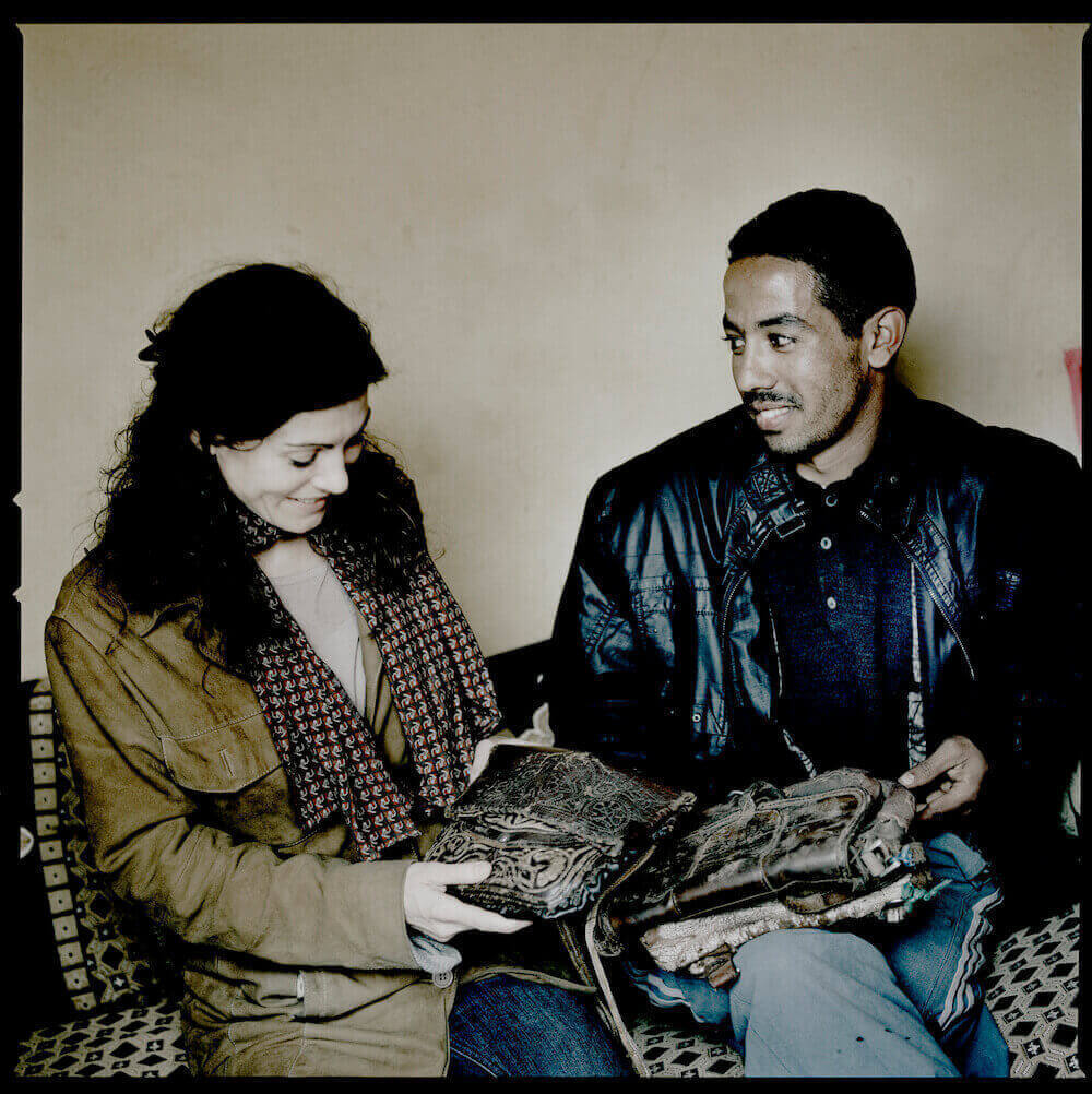 andrea bury looking at a berber bag in morocco