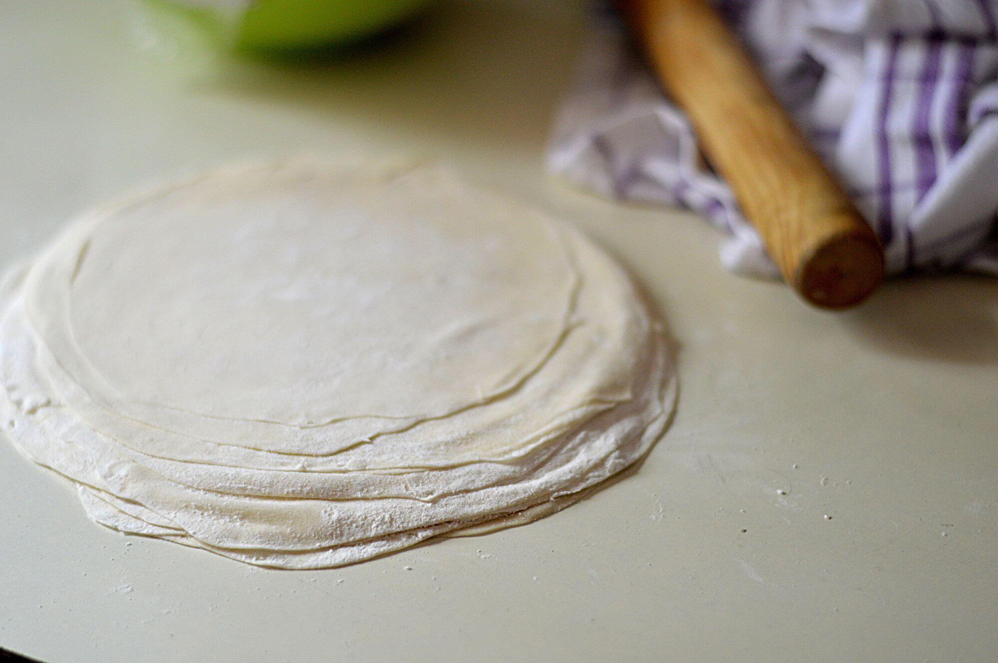 Now give the entire pile of rolled out sheets an additional gentle roll out with a rolling pin.