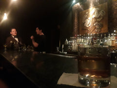 Dark photo of a cocktail at a bar