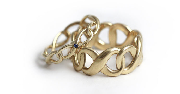 gold set of his and hers promise rings with infinity shape