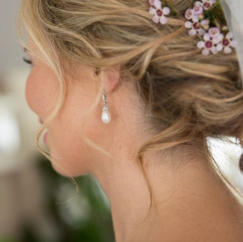 bride wears Beverly earrings