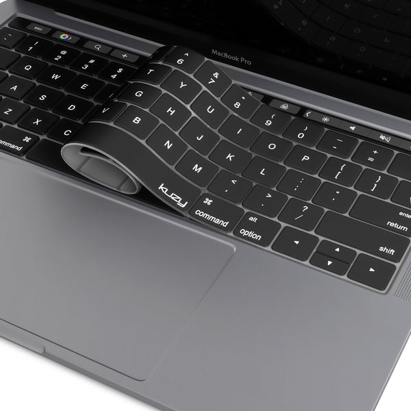 A-black-silicone-keyboard-cover-partially-pulled-back-over-a-MacBook-Pro-keyboard
