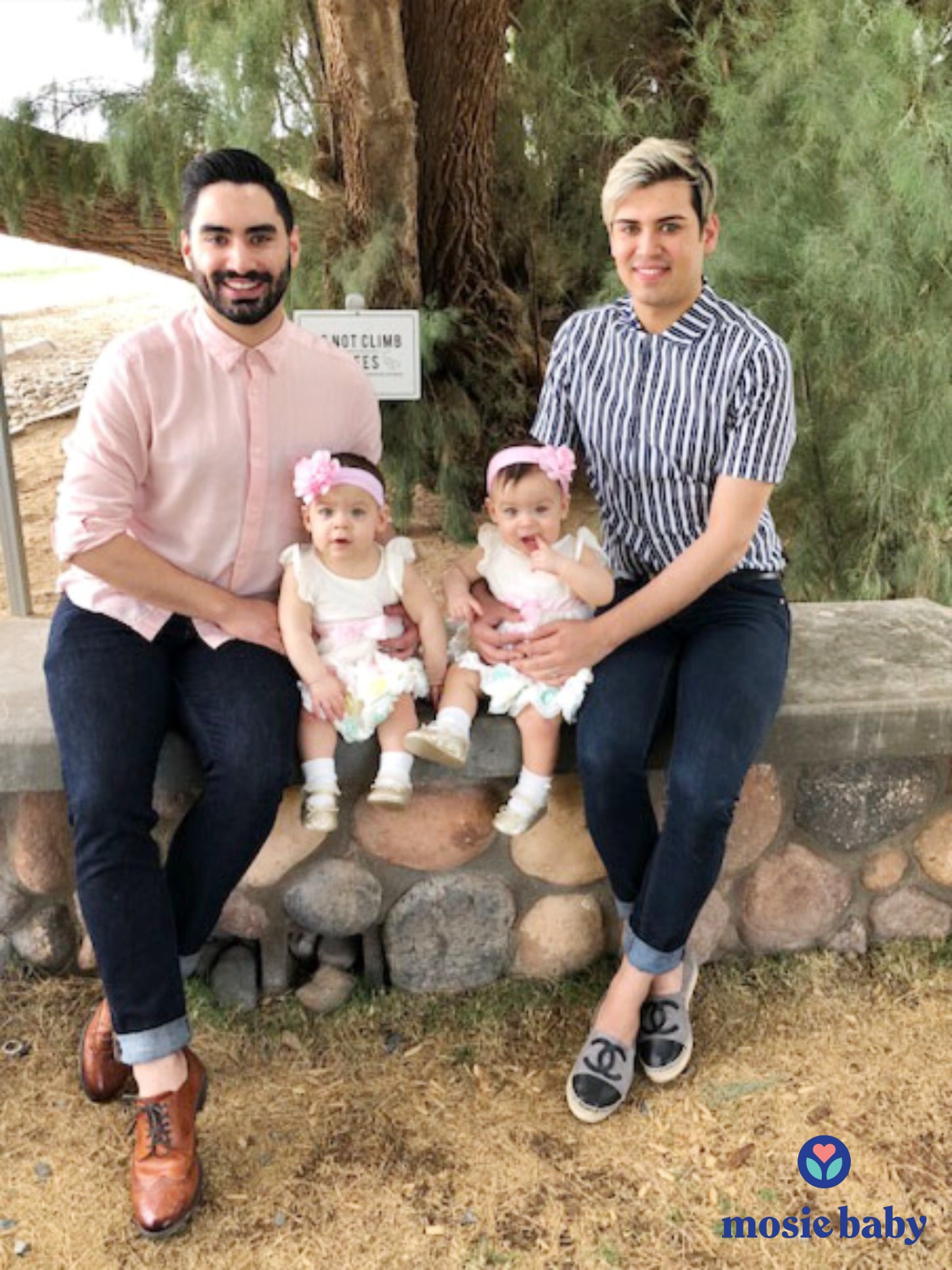 family photo of gay men with their twin mosie babies