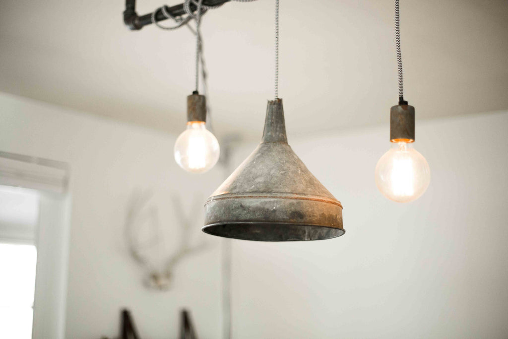 2 Bulbs and 1 Barrel Hanging from Ceiling