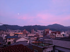 twilight makes purple sky over Kure after flooding