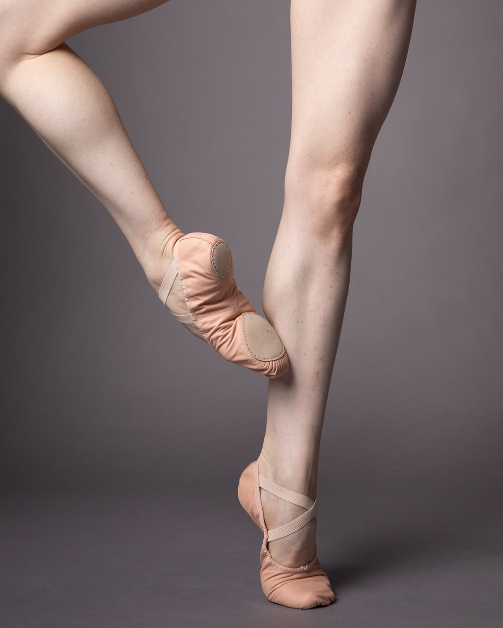 The legs of a ballet dancer wearing the Precision ballet shoes 