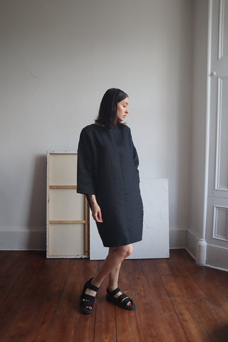 shauna wearing hayley oversized black linen dress with deep pockets and black sandals