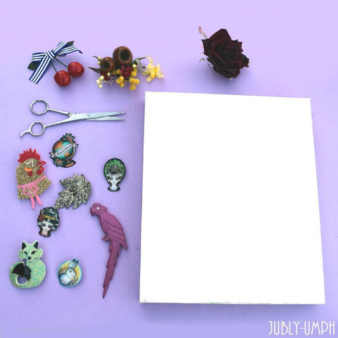 DIY brooch board out of a canvas, material and hot glue gun
