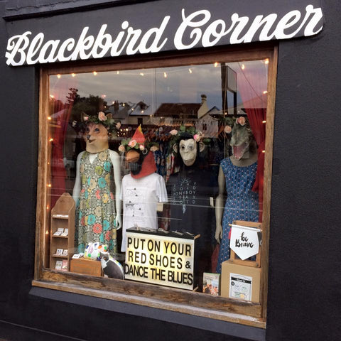 Cute window displays with quotes from iconic movies and songs in Blackbird Corner