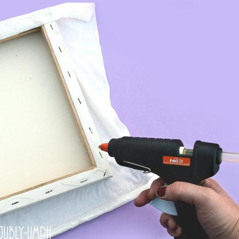 Glue your fabric to the back of your canvas frame- Pin/brooch/hair flower display board DIY