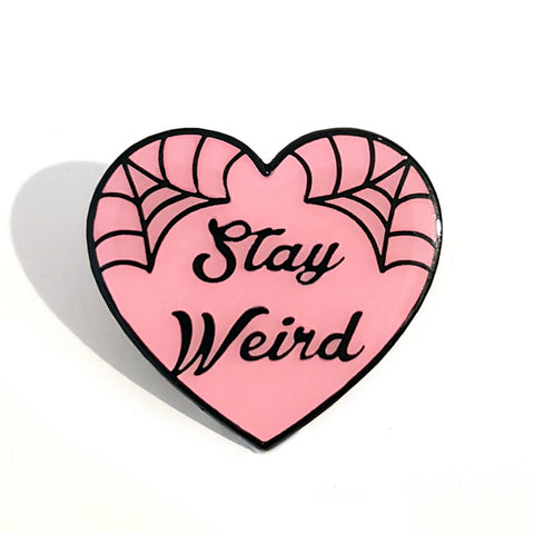 this little soft enamel lapel pin reminds you to stay weird every day