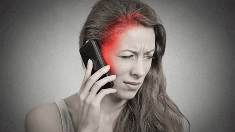 woman holding a cell phone that is emitting radiation 