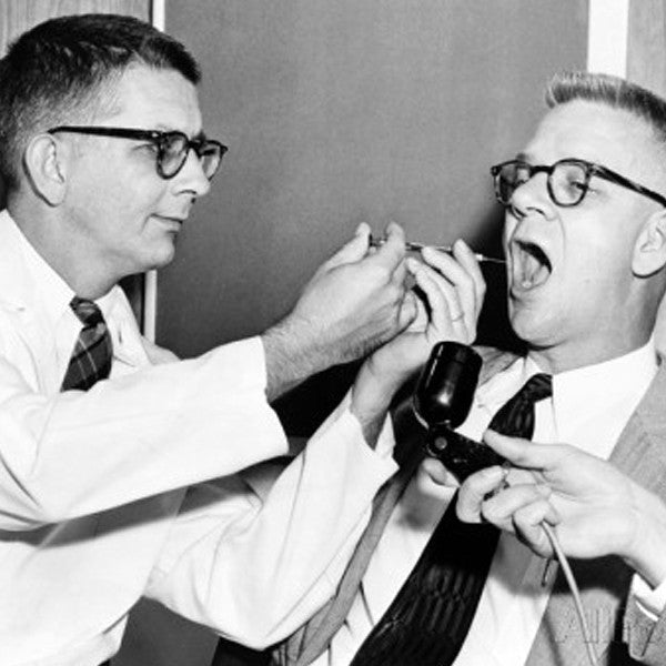 Dr. Harry Williams Squirts LSD into Dr. Carl Pfeiffer's Mouth, 1955