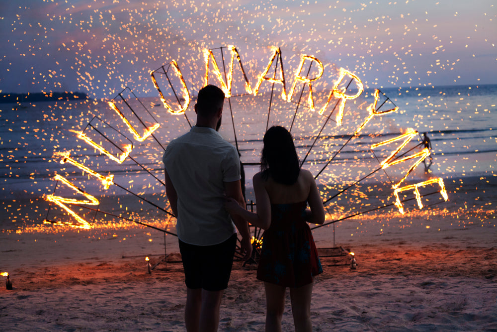 surprise proposal marry me wedding written in fire