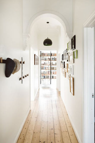 Hats off to this hallway, which was smartly equipped with hooks and hangers to put galleries and head covers and display. 