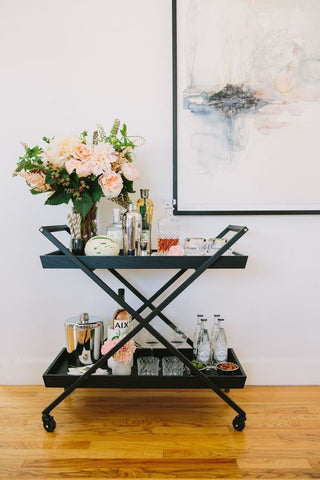 How about a drink trolley Set up your very own cocktail station to display your favourite items. Plus, you can wheel it around your apartment whenever you have guests coming over!