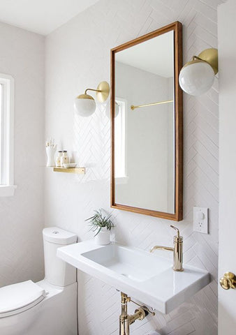 If you want an added illusion of space, installing a mirror will help. They also invite the light in, reflecting any illumination from the source, giving your bath a sense of radiance.