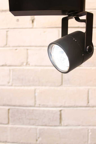 This 12 volt adjustable arm track light has a clean compact urban look with its rounded metal mesh back and matt black finish. The shade head is made from quality die cast aluminium and has a generous 180 degree tilt and 340 degree swivel action.