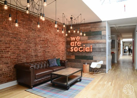 a funky, inspiring workplace using lots of bare bulbs, edison filament bulbs