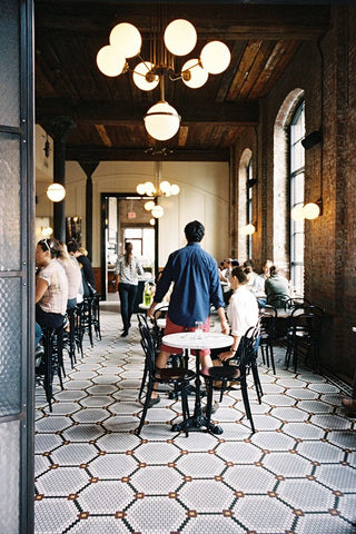 glass ball shades in a cluster used as cafe lighting image via pinterest