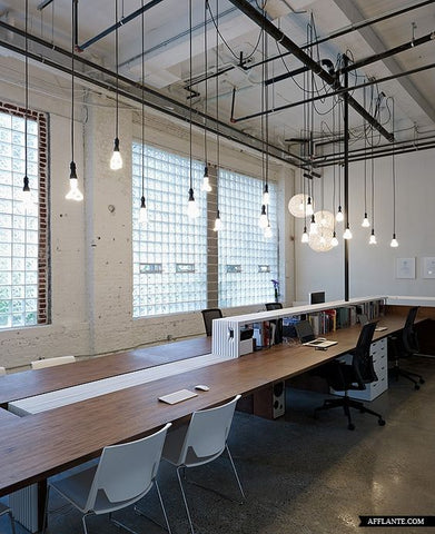 minimalist workplace is made perfect by using Plumen light bulbs