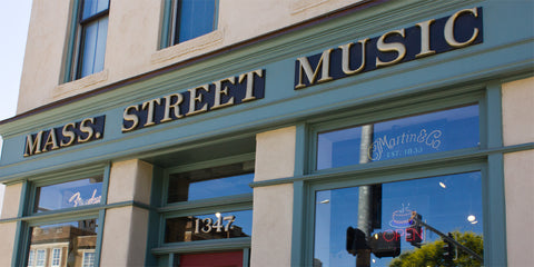 Store front view from the outside at Mass Street Music