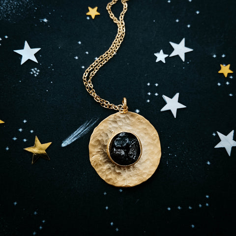 Authentic meteorite jewelry set giveaway on Yugen Tribe blog - round gold necklace with chunk of meteor