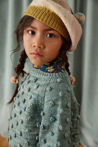 Our favorite Misha and Puff Tam hat is back in landscape colors.  We have baby and girl clothing sizes.  The classic popcorn sweater in Sage will last them all winter.