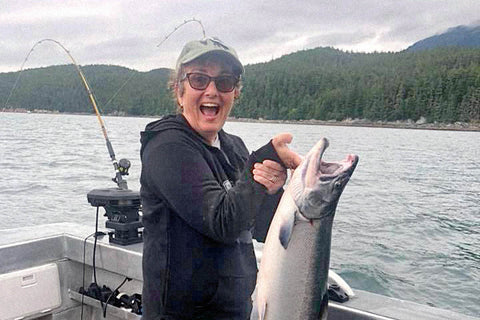 Fran smiles for the camera after catching a huge fish.