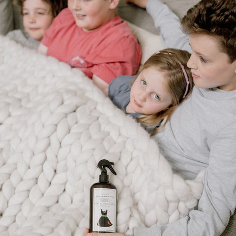 Static Schmatic Laundry size bottle with kids under a cozy blanket for a natural way to tame static cling