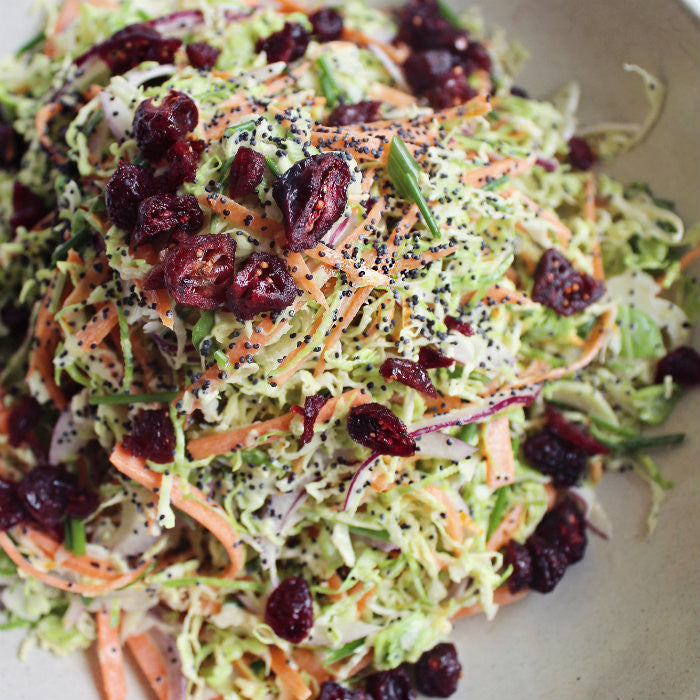 Brussels Sprout and Carrot Slaw with Orange Poppyseed Dressing