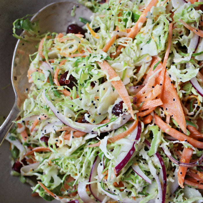 Brussels Sprout and Carrot Slaw with Orange Poppyseed Dressing