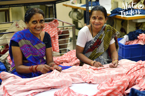 women artisan hand making clothing