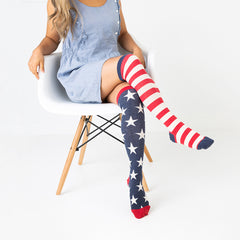 A woman wearing fun American flag knee high socks