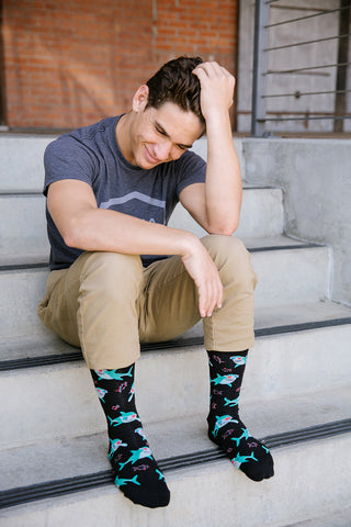 A man wearing cool shark socks