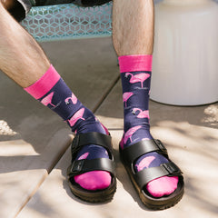 A man wearing crazy flamingo socks