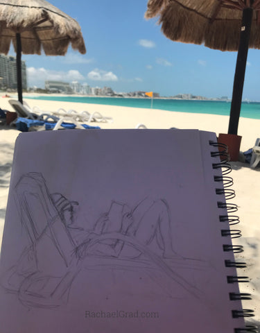 Drawings on the Beach in Mexico woman reading pencil 