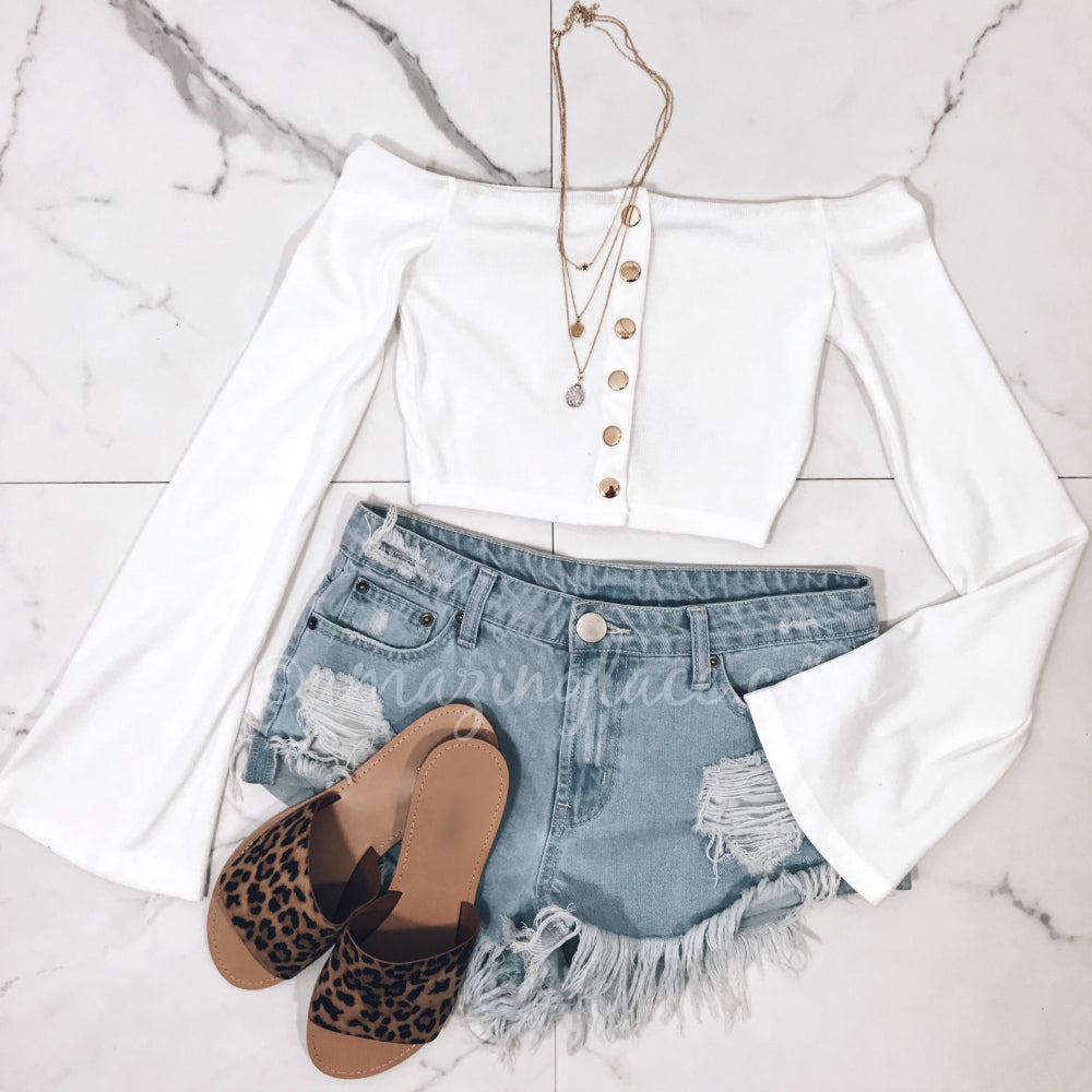 white top and denim shorts