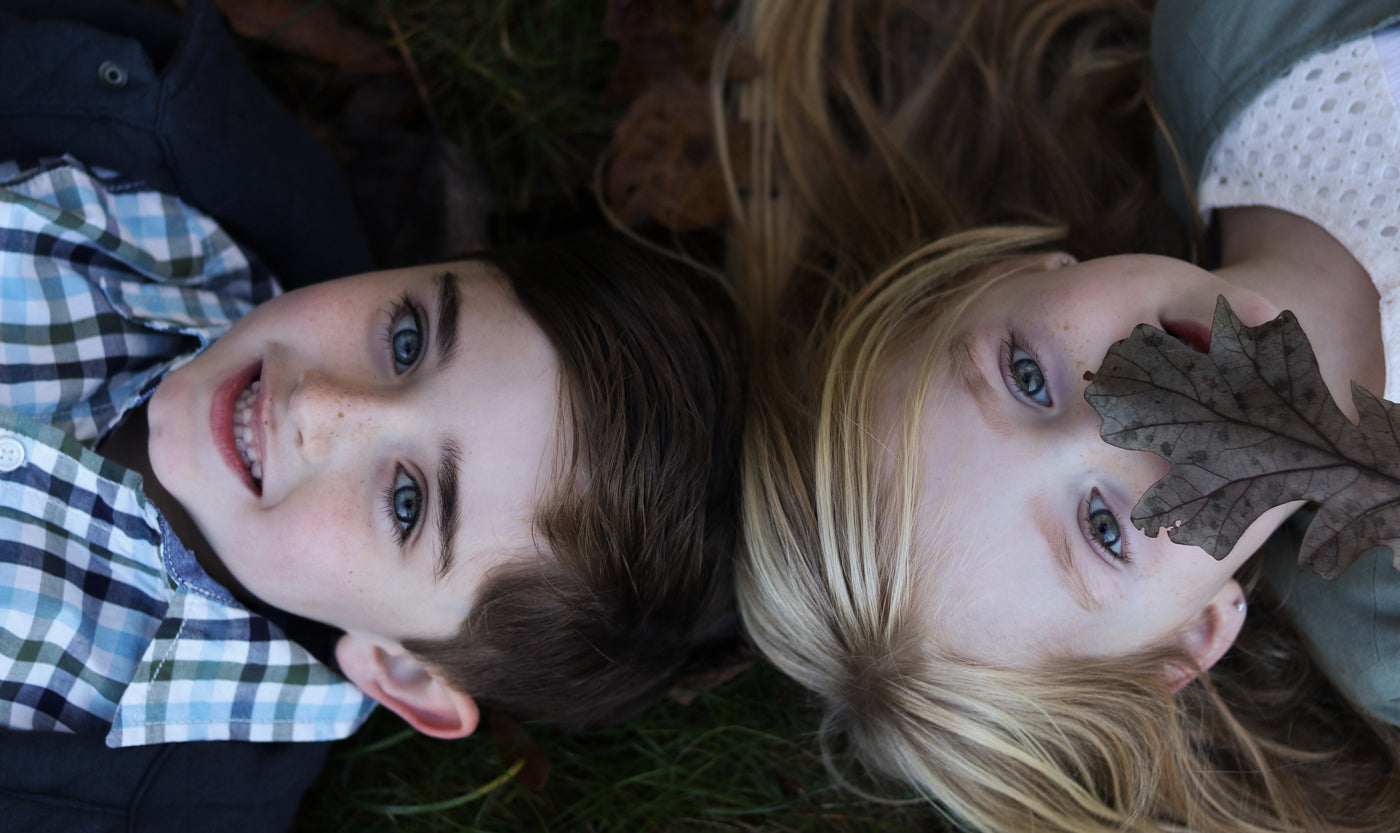 bare-biology-omega-3-two-kids-lying-on-the-floor-smiling
