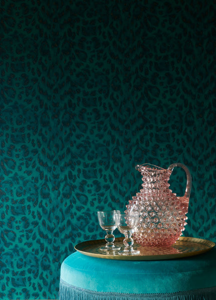 The Felis wallpaper in Teal is a new addition to our wallpaper range. Its striking animal print with metallic flecks, was specifically made to complement the printed Wilderie fabrics and wallpapers.