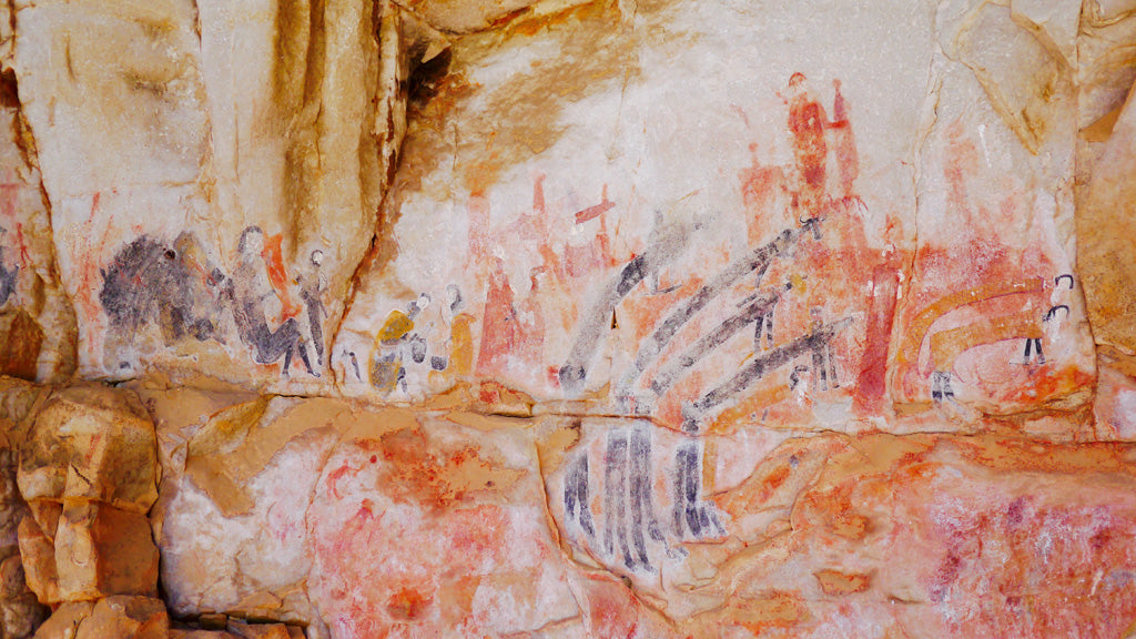 Therianthropes are common in San paintings and would have been painted after coming out of a trance. Here the long black figures appear to have buffalo-type heads