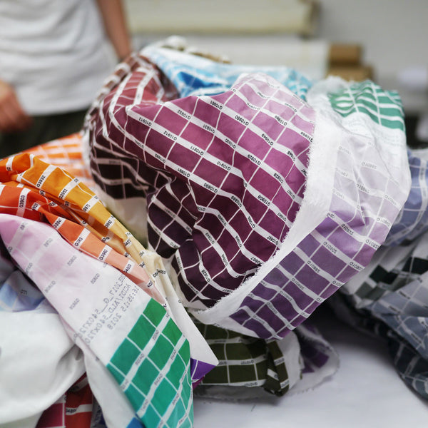 The printing technicians are highly skilled, and use tools like extensive fabric colour swatches to ensure correct colours across the production of a design. 