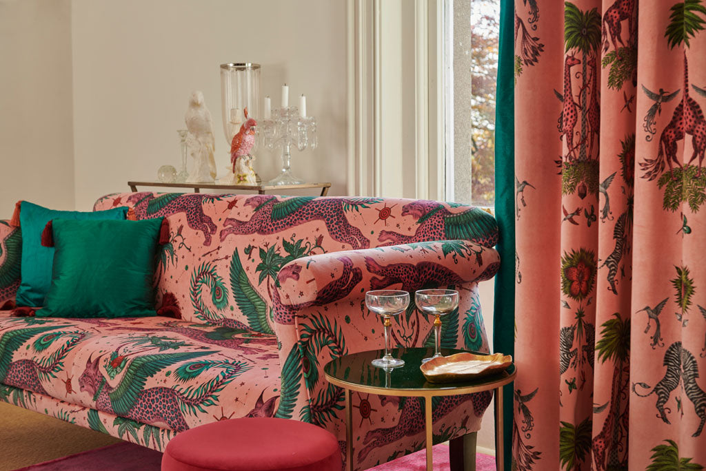 A fantastical sofa upholstered in the Lynx design in Pink Velvet paired beautifully with the Sylph silk cushions in colours Money and Tropic. The curtains also feature Sylph Silk that goes magically with Creatura design featuring giraffes and zebras in Pink Velvet.