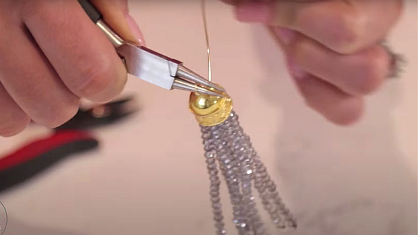 Create a loop on top of the tassel with wire