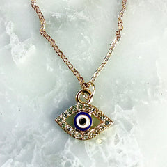 Gold crystal evil eye pendant 