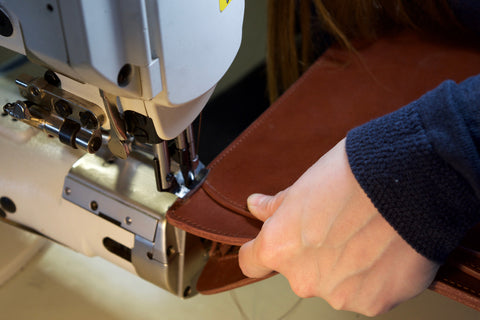 Closing the Lotuff Leather Wells Briefcase in cognac bridle leather