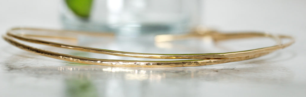 closeup of gold necklaces delia langan jewelry