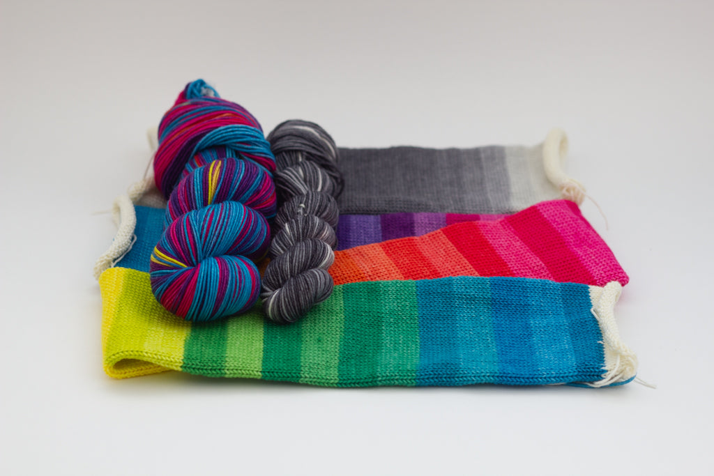 Knitted rainbow yarn from Gauge Dye Works