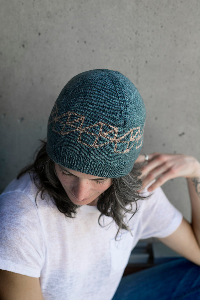 Full Spectrum geometric self striping wool yarn hat by Andrea Rangel knits and gauge dye works